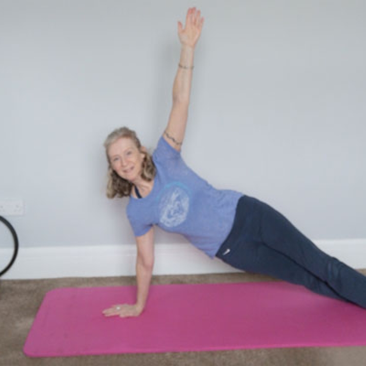 Claire teaching an online Pilates class